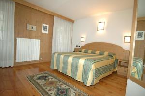 Postel nebo postele na pokoji v ubytování Hotel Sport