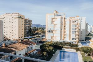 an aerial view of buildings and a swimming pool at Playa & Relax con Piscina Privada in Gandía