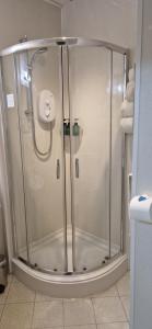 a shower with a glass door in a bathroom at The Dudley Hotel in Blackpool +99 photos