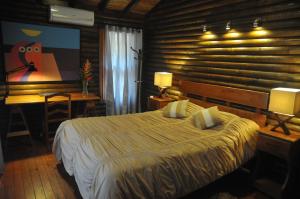 A bed or beds in a room at Hotel San Juan Ometepe