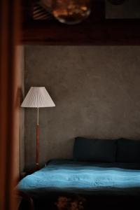Postel nebo postele na pokoji v ubytování Dwell in Quemoy Homestay