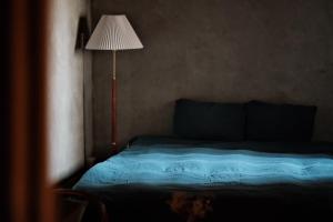 Postel nebo postele na pokoji v ubytování Dwell in Quemoy Homestay