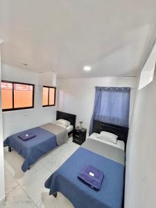 En eller flere senge i et værelse på Global House Apartamento 2 + 8 billeder