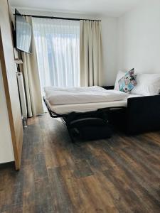Voodi või voodid majutusasutuse Hotel Lainbach in Wängle toas