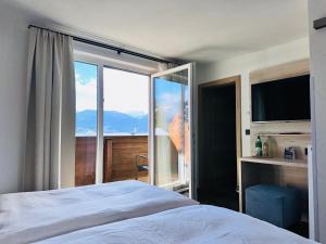 Voodi või voodid majutusasutuse Hotel Lainbach in Wängle toas
