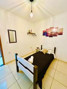 a bedroom with a large bed in a room at L'Aquolina in Socorro +4 photos