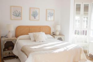 A bed or beds in a room at LUXURY STYLE VILLA AURORA Roche