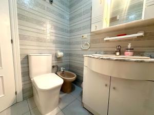 a bathroom with a toilet and a sink at La Mata dream in La Mata +27 photos