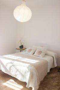 A bed or beds in a room at LUXURY STYLE VILLA AURORA Roche