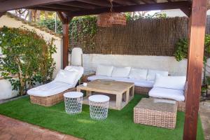 A seating area at LUXURY STYLE VILLA AURORA Roche