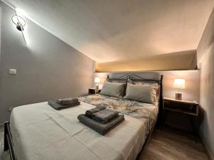 a bedroom with a large bed with two pillows on it at Nikiti Spathies Resort - Double Bedroom Sofita in Kalogria
