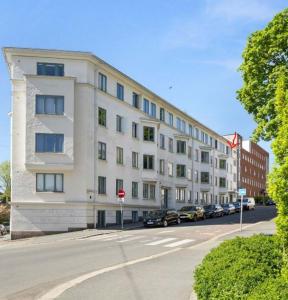 a large white building on the side of a street at Professor Dahls Gate 16 in Oslo
