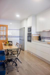 A kitchen or kitchenette at LUXURY STYLE VILLA AURORA Roche