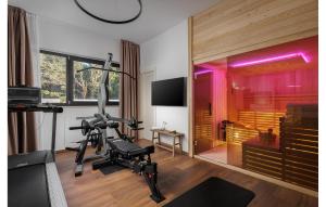 a living room with a gym with a treadmill at Lovely Home In Zambratija With Kitchen in Zambratija