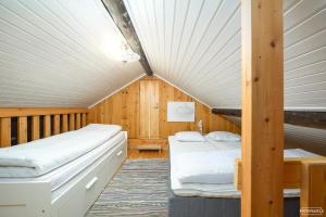 Postel nebo postele na pokoji v ubytování Mairen aito mökki