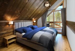 Postel nebo postele na pokoji v ubytování Chalet Oasis - Luxusná chata s výhľadom, pri Zuberci a Kvačianskej doline