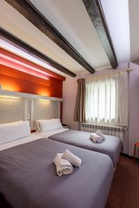 Voodi või voodid majutusasutuse Hotel Micolau toas