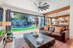 a living room with a couch and a table at Midtown 6bed 5bath w pool and sauna in Atlanta