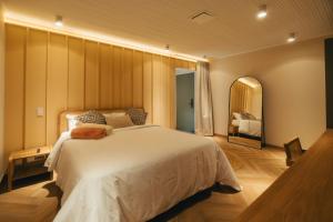 Voodi või voodid majutusasutuse Hotel Boutique Roomzz Laureles toas