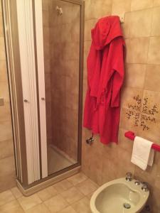 a bathroom with a shower and a red towel at Villa Adele Monopoli,Puglia in Faccia di Trippa