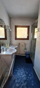 a bathroom with a sink and a mirror and a shower at Résidence Le Dôme - maeva Home - Appartement 3 pièces 6 personnes - Confort MAE-6221 in La Mongie