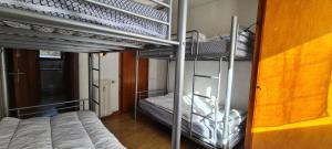 a couple of bunk beds in a room at Résidence Le Dôme - maeva Home - Appartement 3 pièces 6 personnes - Confort MAE-6221 in La Mongie +4 photos