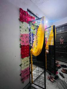 a wall with a slide in a room with shoes at Family Homestay near Sangam in Prayagraj