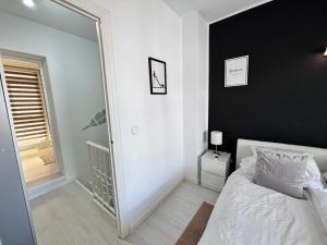 Łóżko lub łóżka w pokoju w obiekcie Laguna Beach, Todos los Santos