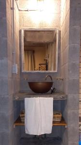 a bathroom with a sink and a mirror at Departamentos La victoria in Mar del Sur
