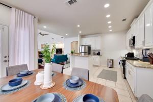 a kitchen and living room with a table and chairs at 4 Mi to Dtwn Family Home with Games in Frisco in Frisco