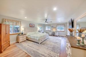 a large bedroom with a bed and a desk at Charming Idaho Home with Hot Tub, Near Beaches! in Sagle