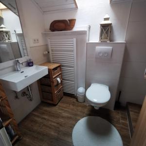 a small bathroom with a sink and a toilet at Hennetraum in Meschede +23 photos