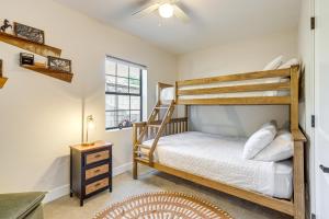 a bedroom with two bunk beds and a window at 1 Mi to Grand Ave Modern Home with Spacious Yard! in Phoenix