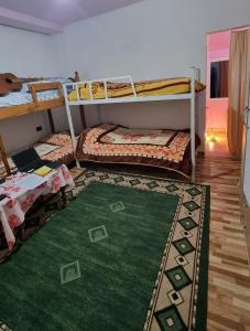 Postel nebo postele na pokoji v ubytování Guesthouse Gjegji