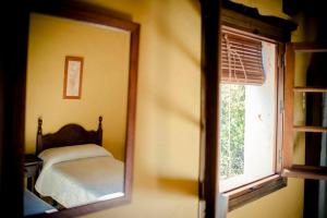 Postel nebo postele na pokoji v ubytování Hotel Enrique Calvillo