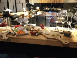 a kitchen with a table with food and glasses of wine at Hammamhane in Istanbul