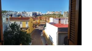 a view of a city street with buildings at Hotel Luz de Guadiana in Ayamonte