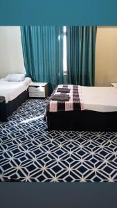Postel nebo postele na pokoji v ubytování Ekm Hotel