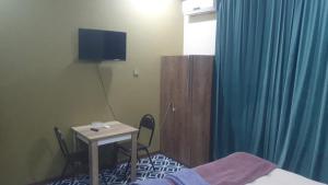 TV a/nebo společenská místnost v ubytování Ekm Hotel