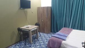 Postel nebo postele na pokoji v ubytování Ekm Hotel