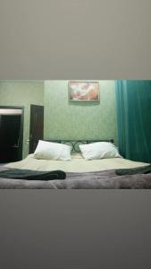 Postel nebo postele na pokoji v ubytování Ekm Hotel