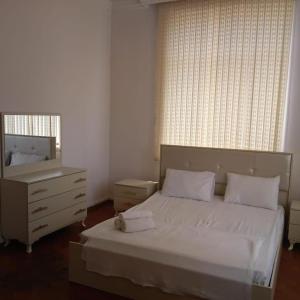 Postel nebo postele na pokoji v ubytování Ekm Hotel