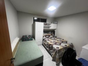 En eller flere senge i et værelse på Apto no Farol Velho - Salinópolis PA + 22 billeder