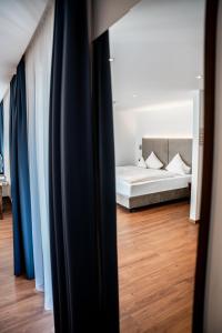 Postel nebo postele na pokoji v ubytování Hotel Maria Theresia + 37 fotografií