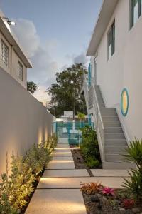 a stairway leading up to a building with a building at Aquabella 4 Island Serenity in Isla Verde in San Juan