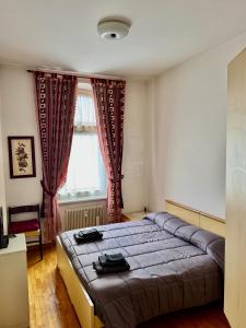 Giường trong phòng chung tại La tua Casa a Tarvisio