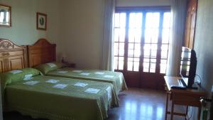Säng eller sängar i ett rum på Hotel Luz de Guadiana
