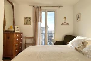 En eller flere senge i et værelse på Le Mandela - Centre Historique Perret