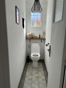 Koupelna v ubytování Appartement spacieux + 6 fotografií