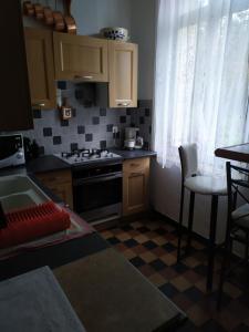 Η κουζίνα ή μικρή κουζίνα στο Chambre dans maison bourgeoise 1 personne